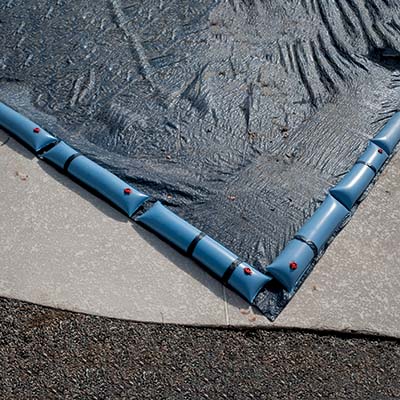 secure the cover on your vinyl pool to protect the liner