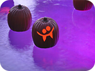 scary pumpkin floating in pool