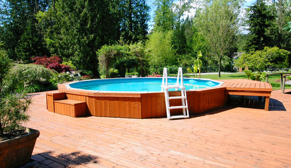 aboveground pool with wood deck istockphoto