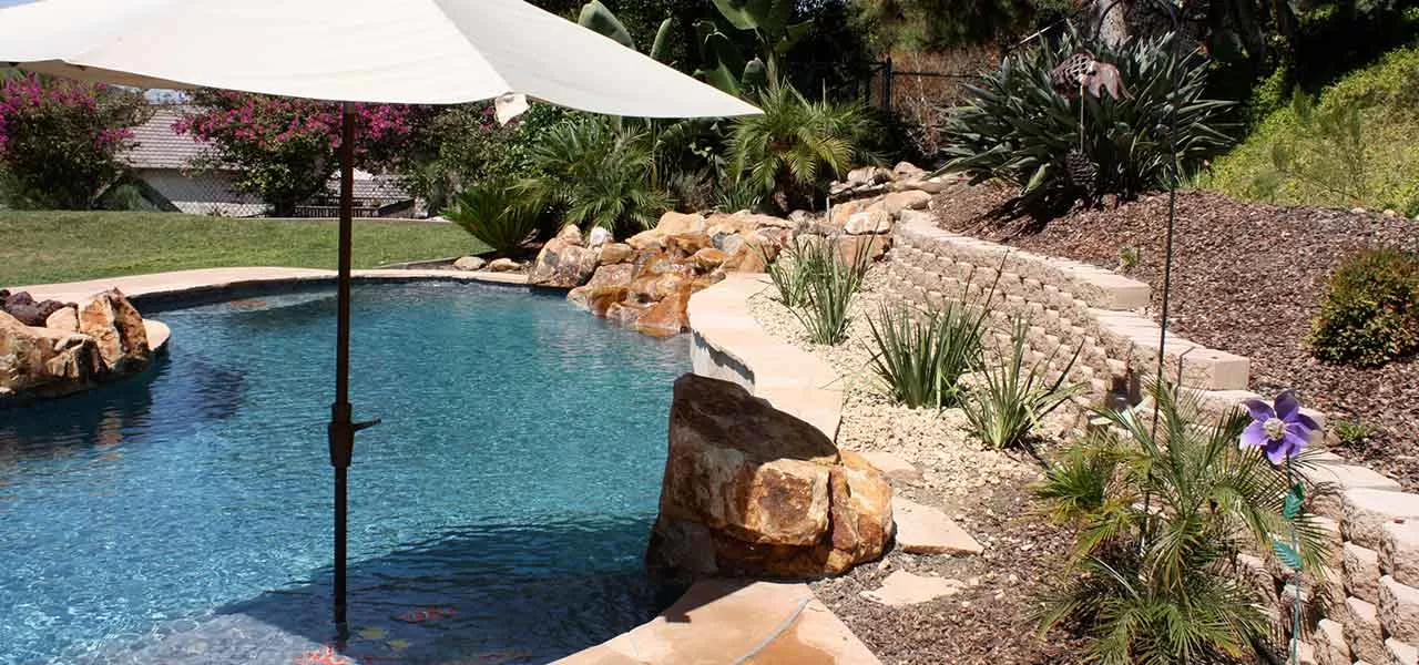 installing a pool side or in pool umbrella