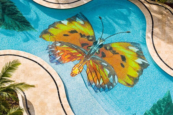 Beautiful Monarch butterfly pool mosaic. Photo by Backsplashtogo.com