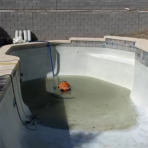 draining an inground pool with a wet vac
