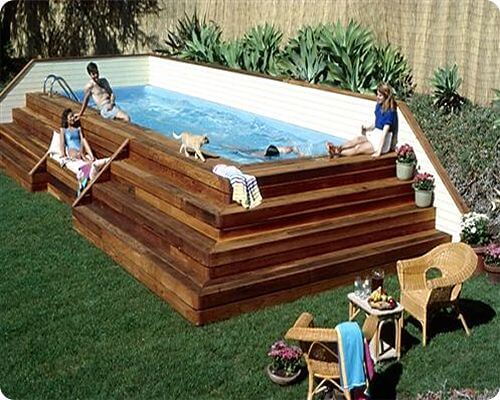 corner placement above ground pool with terraced deck steps