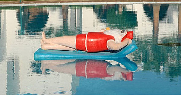 Santa floating in the pool