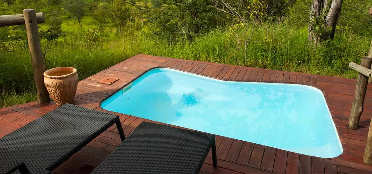 freeform pool on wooden deck